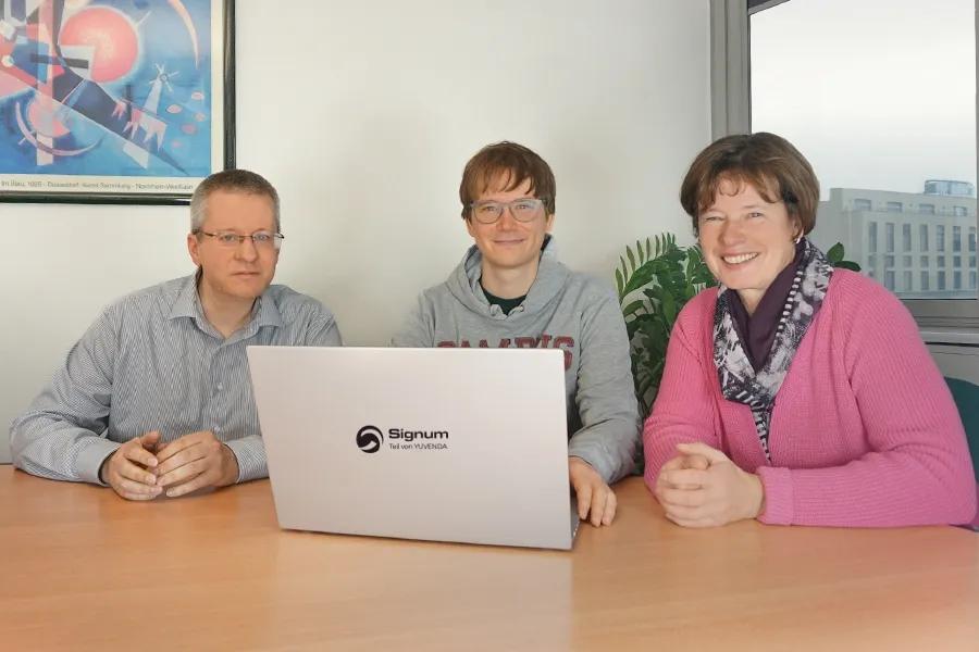 Signum Team-Mitglieder beim Meeting